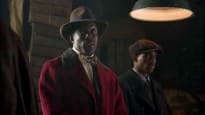 Chalky White In Red Overcoat With Astrakhan Collar