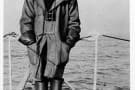 Lieutenant Basil Beal wearing foul weather gear, taken in 1914 on the HMS B1 duffle coat, leather gauntlets and heavy sea boots
