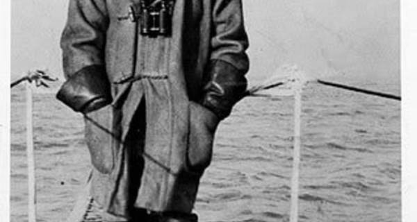 Lieutenant Basil Beal wearing foul weather gear, taken in 1914 on the HMS B1 duffle coat, leather gauntlets and heavy sea boots