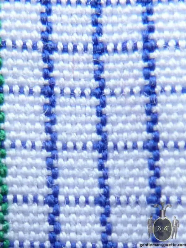A blue and white piece of fabric with a Check weave