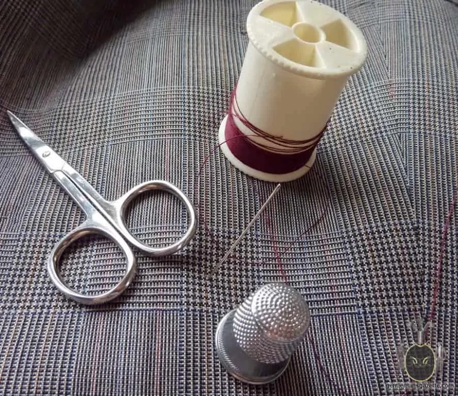 Tools needed for a boutonniere loop. Scissors, thimble, thread and needle
