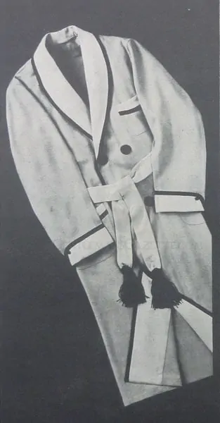 A black and white photograph of a vintage dressing gown