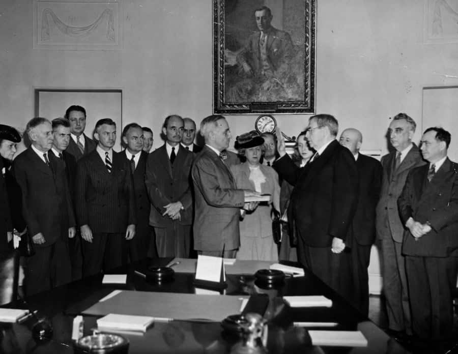 Chief Justice Harlan F. Stone administering the oath of office to Harry S. Truman in the Cabinet Room of the White House, April 12, 1945