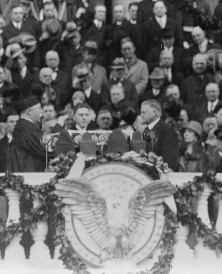 Chief Justice William H. Taft administering the oath of office to Herbert Hoover on the east portico of the U.S. Capitol, March 4, 1929