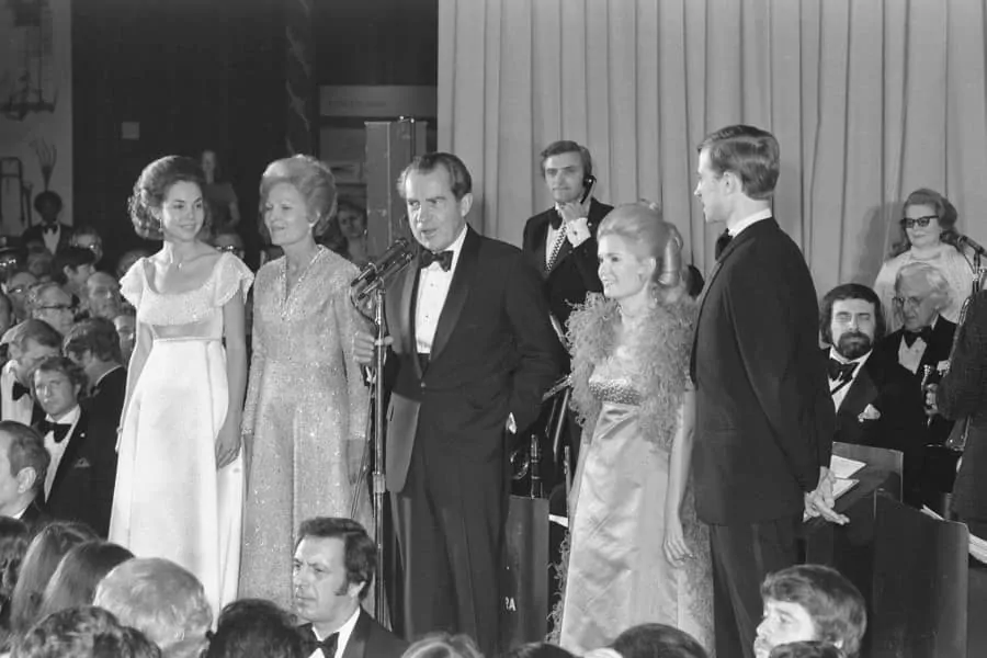 Nixon in black tie at the inaugurational ball with shawl collar tuxedo, cummerbund & studs