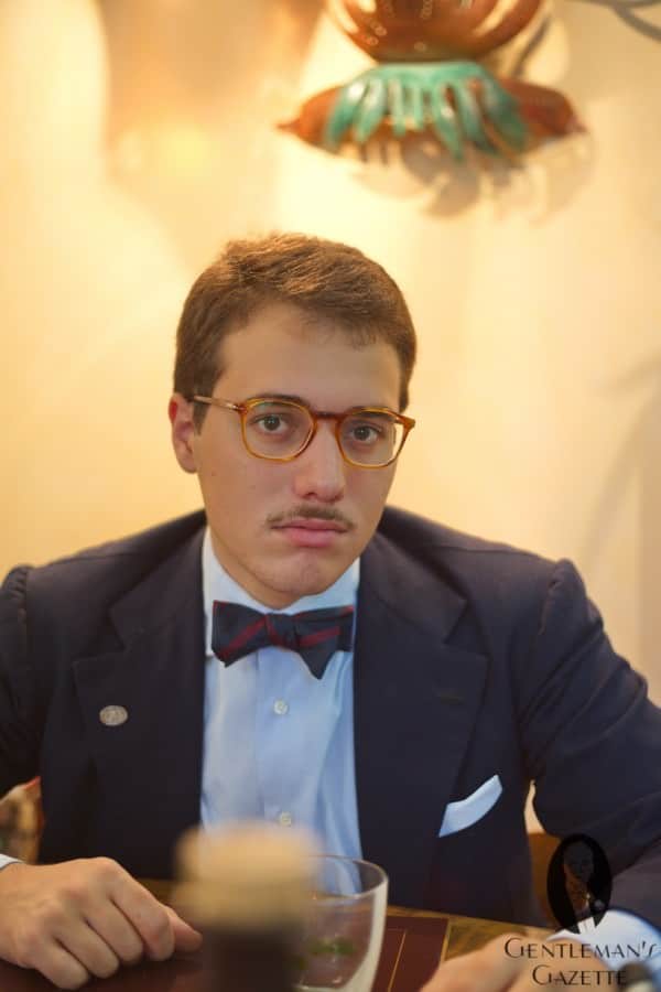 Giuseppe with bow tie, mustache, & navy blazer