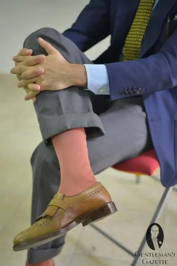 Salmon colored over the calf socks with cognac shoes