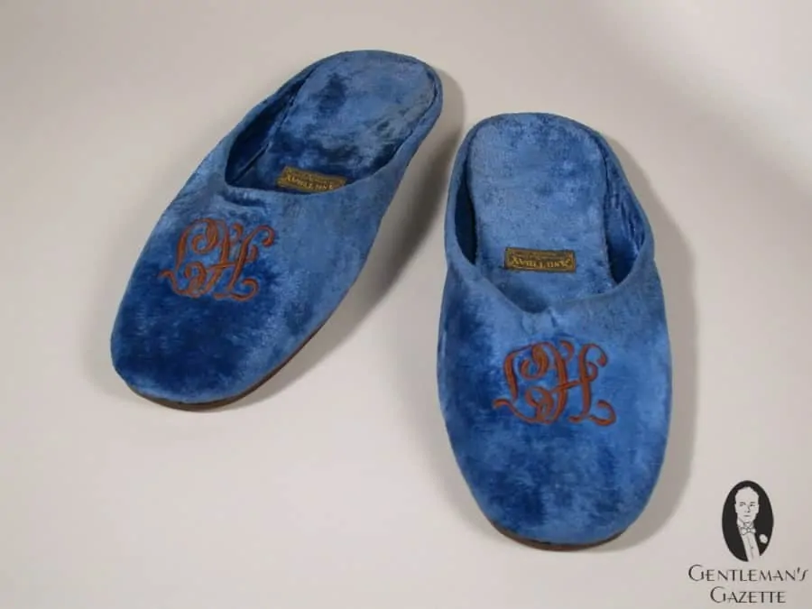 Monogrammed velvet slippers of Truman - note the HT is engraved upside down