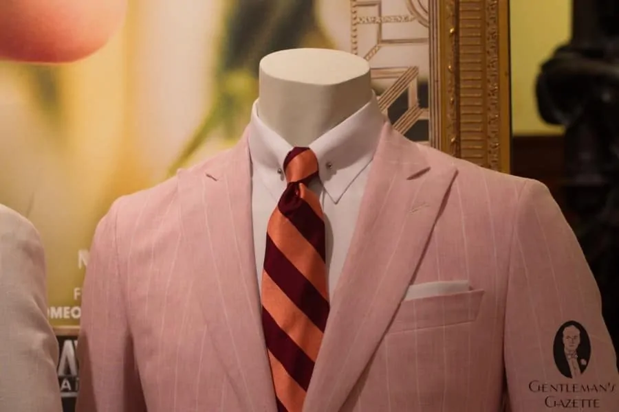 Pink linen suit close-up with repp tie & collar bar