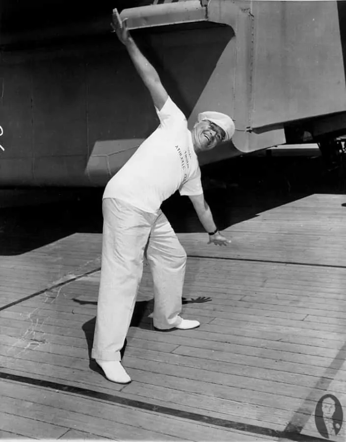 Truman in white shoes aboard a ship