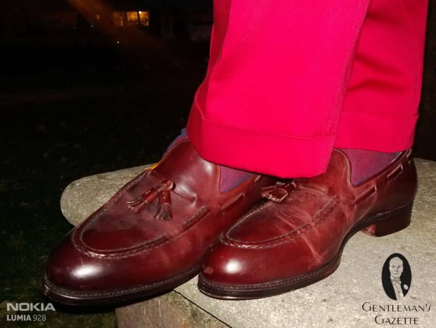 Oxblood Cordovan Tassel Loafers by Meermin, with red blue striped socks by Fort Belvedere & red Indochino slacks
