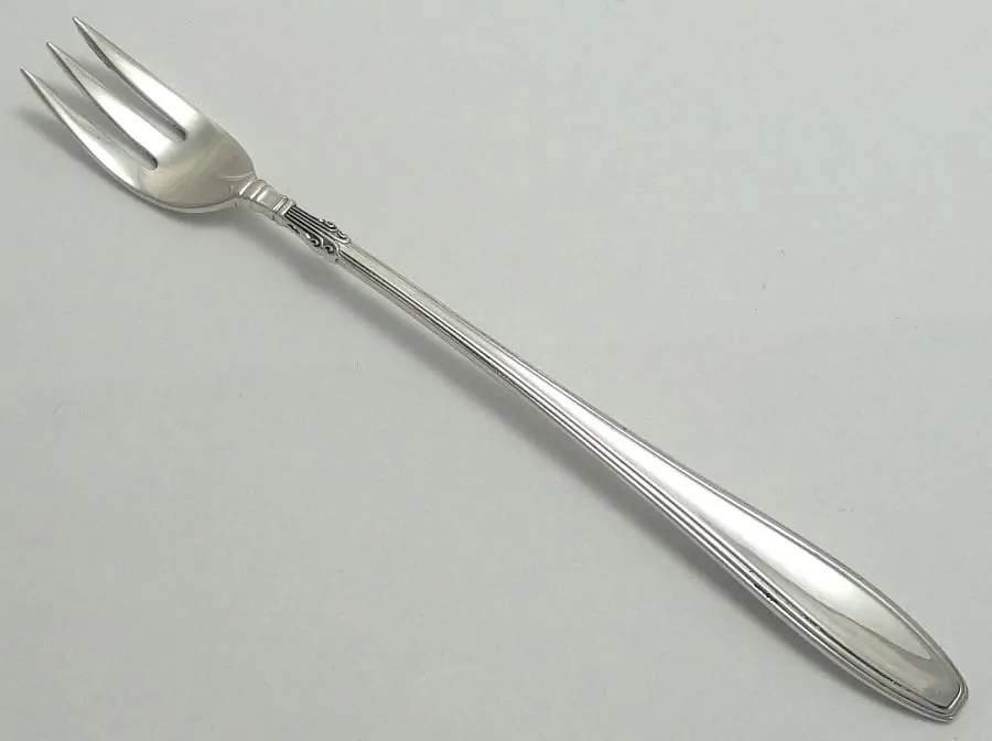 A seafood fork may be placed to the right of the spoons and will be used to eat shellfish.