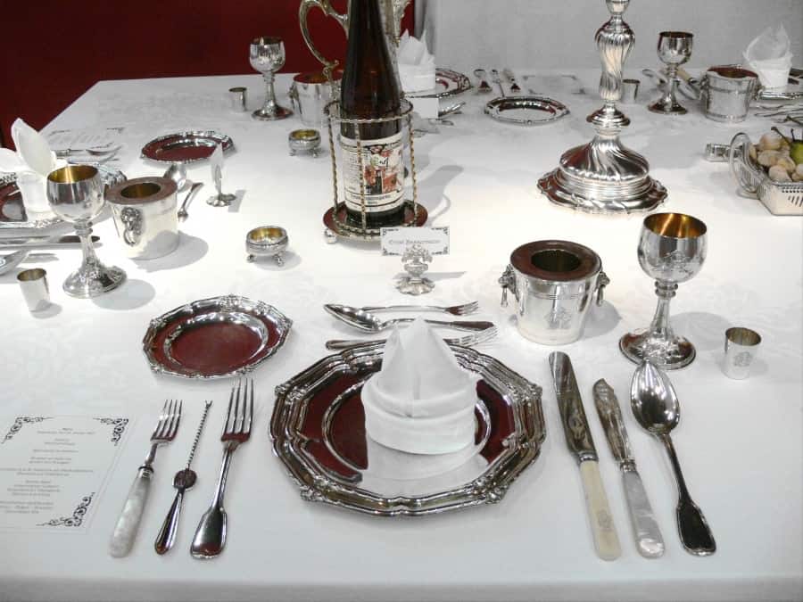 Formal place setting with both a lobster pick on the left and a fish knife on the right