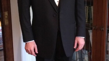 Stephen Ozcomert in black tie with 4 visible shirt studs