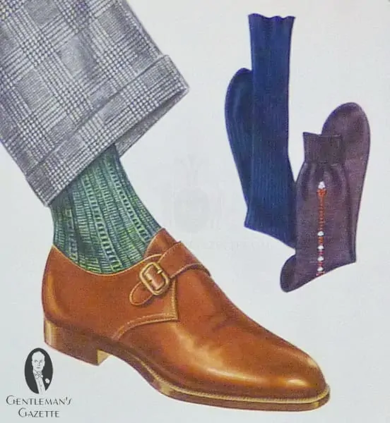 Mid brown monk strap shoe with green socks and classic prince of wales suit