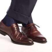 A pair of Shadow Stripe Ribbed Socks Dark Navy Blue & Royal Blue worn with Burgundy Derby Dress Shoe