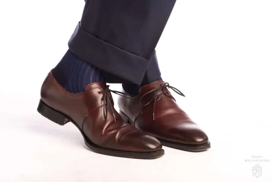 A pair of Shadow Stripe Ribbed Socks Dark Navy Blue & Royal Blue worn with Burgundy Derby Dress Shoe