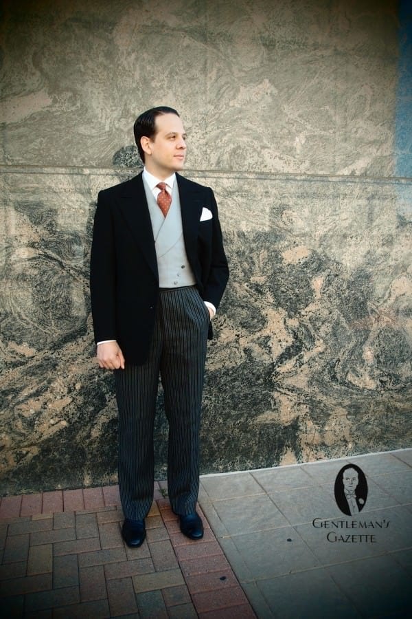 Sven Raphael Schneider in a Stroller Suit with Contrasting Vest
