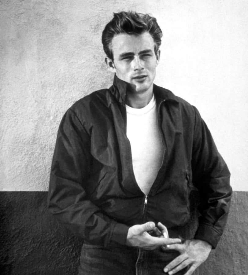 Dean in an iconic publicity still from Rebel Without a Cause, wearing his signature red Harrington jacket.
