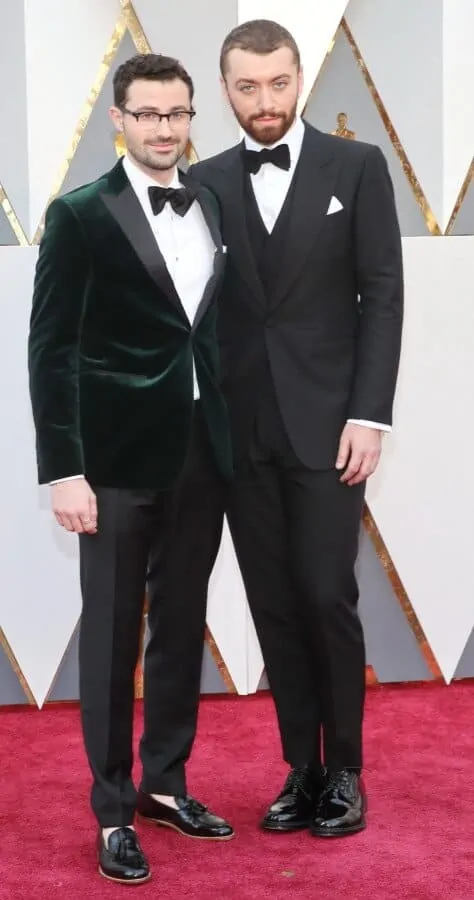 Sam Smith and unknown - velvet green dinner jackets are nice but sockless tassel loafers are not for black tie events