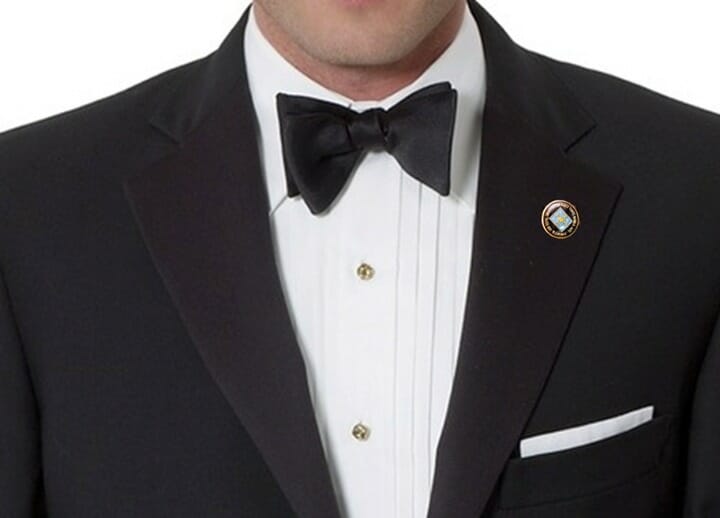 Brooks Brothers black tie outfit with an American flag pin in the lapel buttonhole