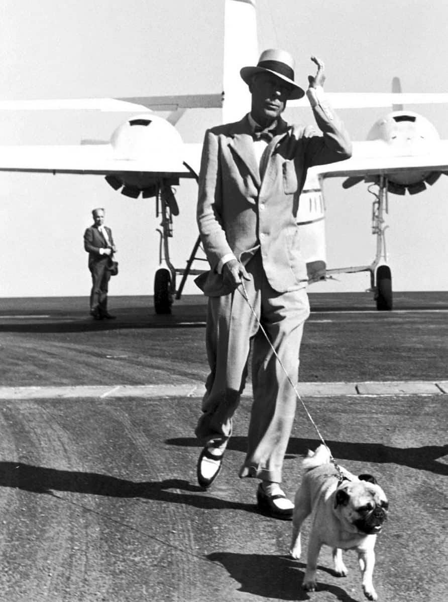 Duke of Windsor in suit with bow tie, hat and two tone Penny Loafers