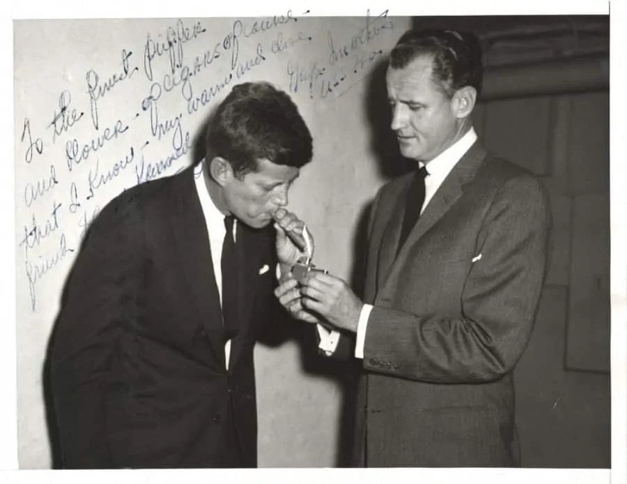 JFK LIGHTS UP CIGAR WITH HIS CLOSE FRIEND SENATOR GEORGE SMATHERS OF FLORIDA - IN THEIR BACHELOR DAYS JFK AND SMATHERS SHARED A TOWNHOUSE IN UPSCALE GEORGETOWN