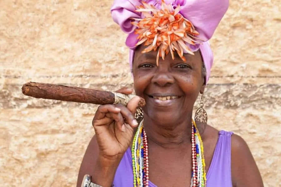 Typical woman with show cigar in Cuba
