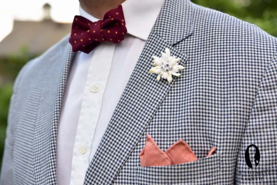 Lightweight cotton wool fabric in navy and white gingham pattern with slim lapel