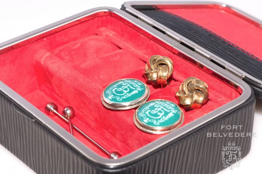 Compartment for collar pins, cuff links and other tid bits in the travel men's jewelry kit