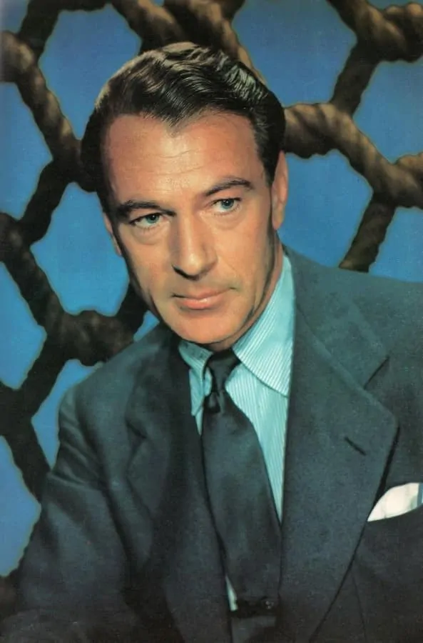 . Gary Cooper, 1947 in a grey jacket and silk tie with pin stripe shirt