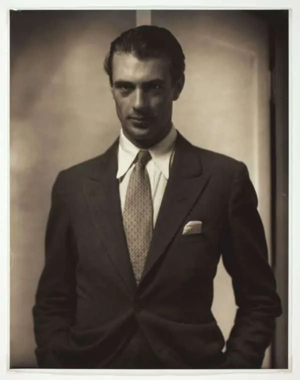 Gary Cooper in a black SB suit with tie and white pocket square