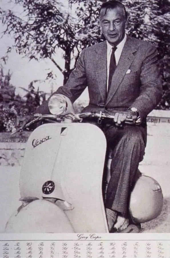 Gary Cooper riding a vespa wearing a tweed SB suit