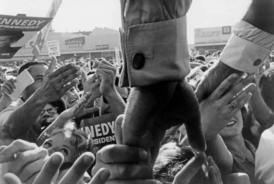 JFK wearing cufflinks in 1960 by Cornell Capa