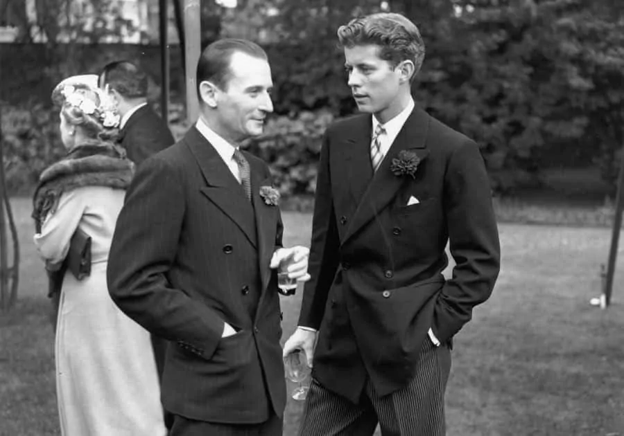 JFK with Neal Borum in 1939 wearing a double breasted stroller suit with striped trousers, double breasted jacket and carnation boutonniere