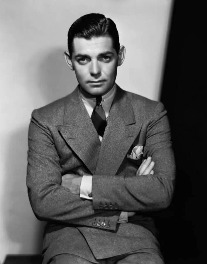 Clark Gable wearing a wide peaked lapel tweed suit