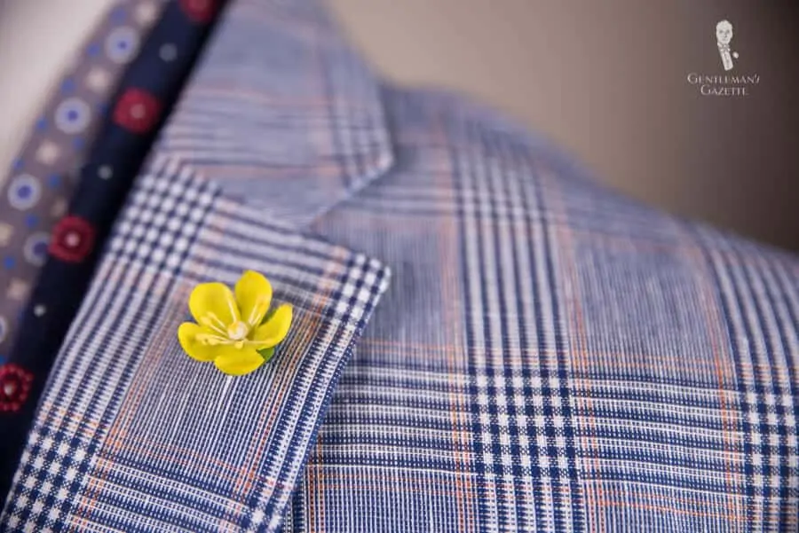 Buttercup boutonniere in yellow work well with summer sport coats