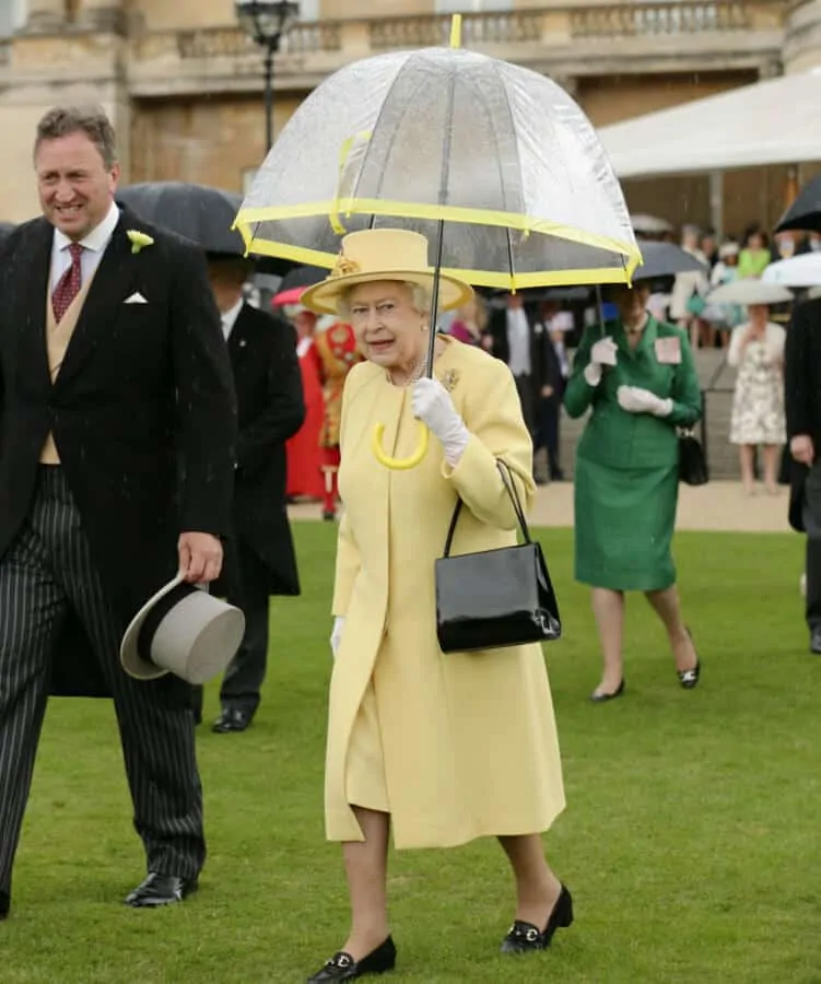 Queen Elizabeth II with a bubble umbrella