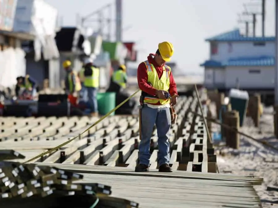 Construction workers work to rebuild the boardwalk in Seaside Heights in anticipation of Memorial Day weekend.