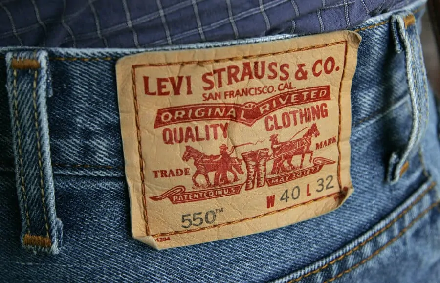 The familiar red tag from a pair of Levi's 550 jeans is seen Tuesday, Oct. 11, 2005, in San Francisco. Levi Strauss & Co.'s thirdñquarter profit dropped 18 percent because of higher income taxes, but sales edged up slightly to put the jeans maker on pace to end an eightñyear streak of declining revenue. The San Franciscoñbased company said Tuesday that it earned $38.2 million for the three months ended Aug. 28, down from $46.6 million at the same time last year. Levi's management attributed the decline to an income tax benefit that lifted last year's results. (AP Photo/Ben Margot)