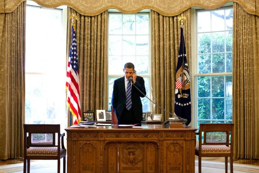 President Obama at his desk in the Oval Office
