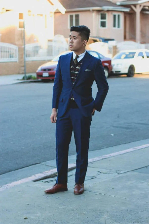 Navy suit paired with fair isle sweater vest