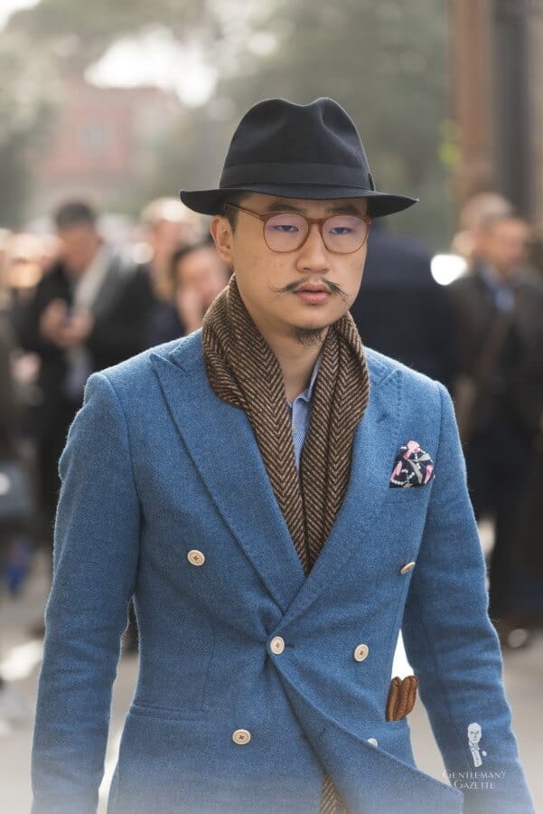 Light Blue Wool Sprot coat with contrast buttons in 6x2 DB style with hat, brown herringbone scarf and blue twill shirt with peccary gloves