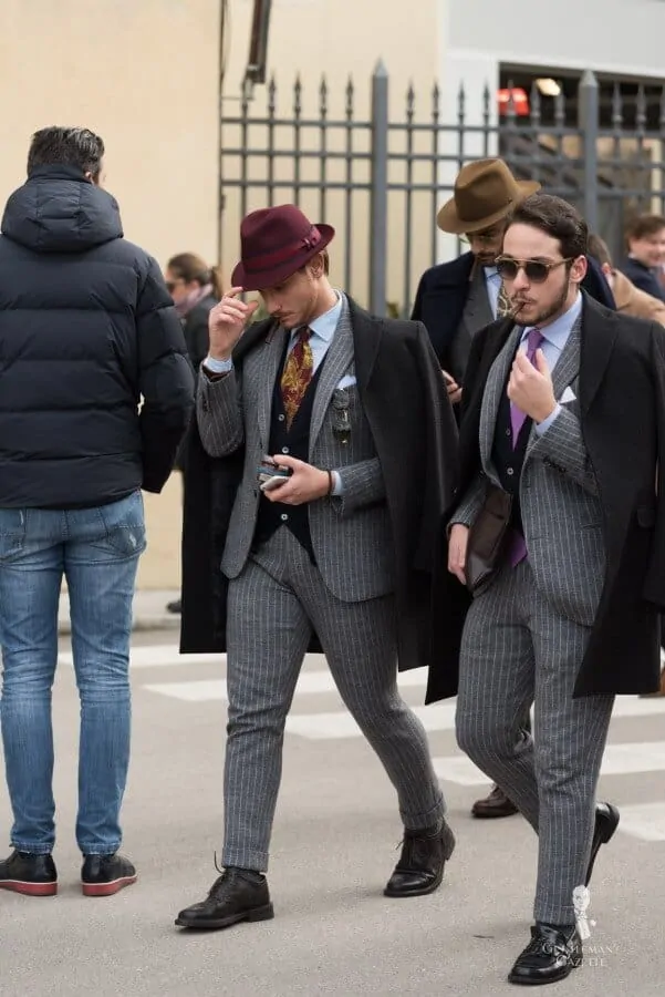 Partner Look with grey Striped suits with navy cardigans, blue shirts, dotted socks etc
