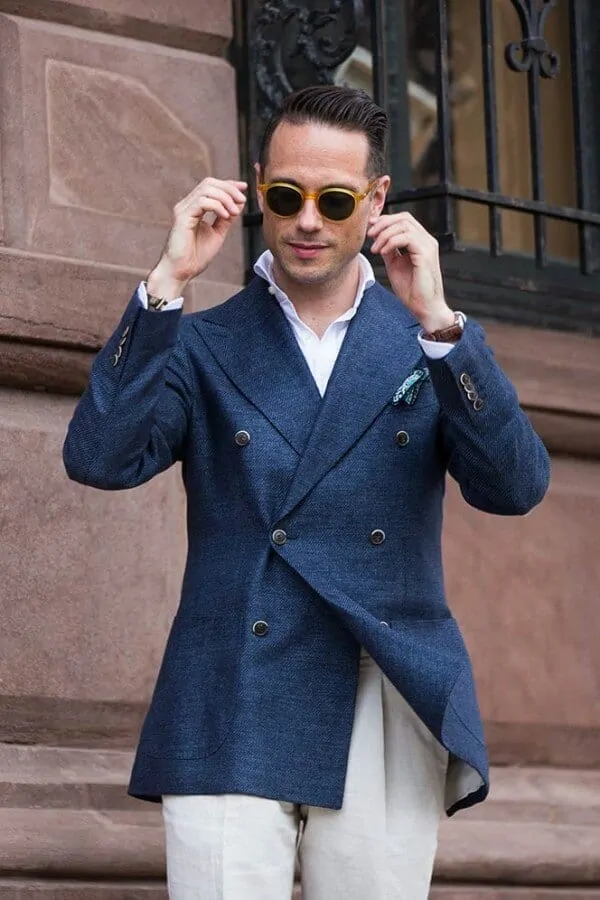 Brian Sacawa in a blue diagonal twill DB blazer with horn buttons and contrasting light colored trousers