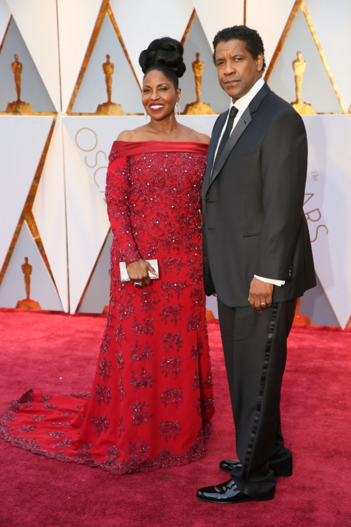 Denzel Washington with black necktie and pants that are way too long