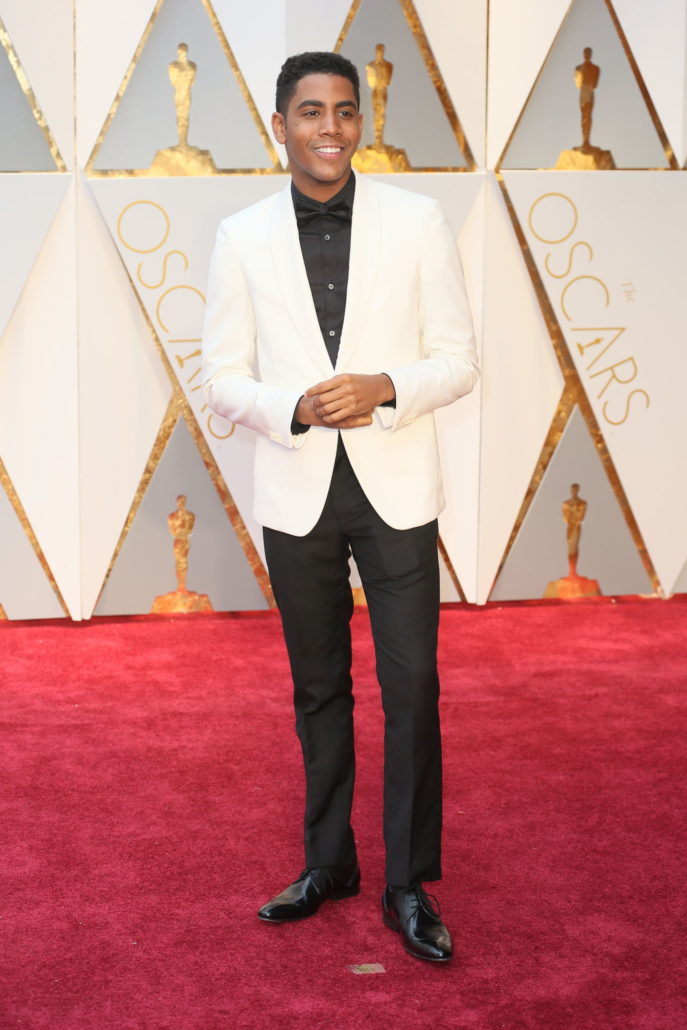 Jharrel Jerome in white dinner jacket withou pocket square and black shirt, with pre-tied bow tie