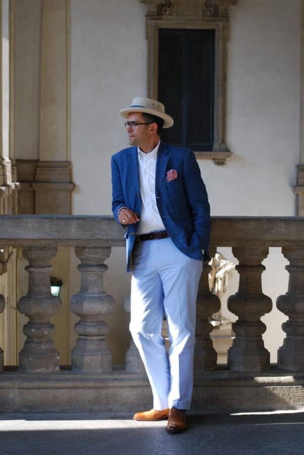 Pedro Mendes in summer blue jacket with pink flowery pocket square, white button down shirt, sky blue chinos and tan oxfords