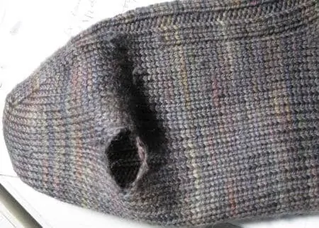 A photo of a hole in sock