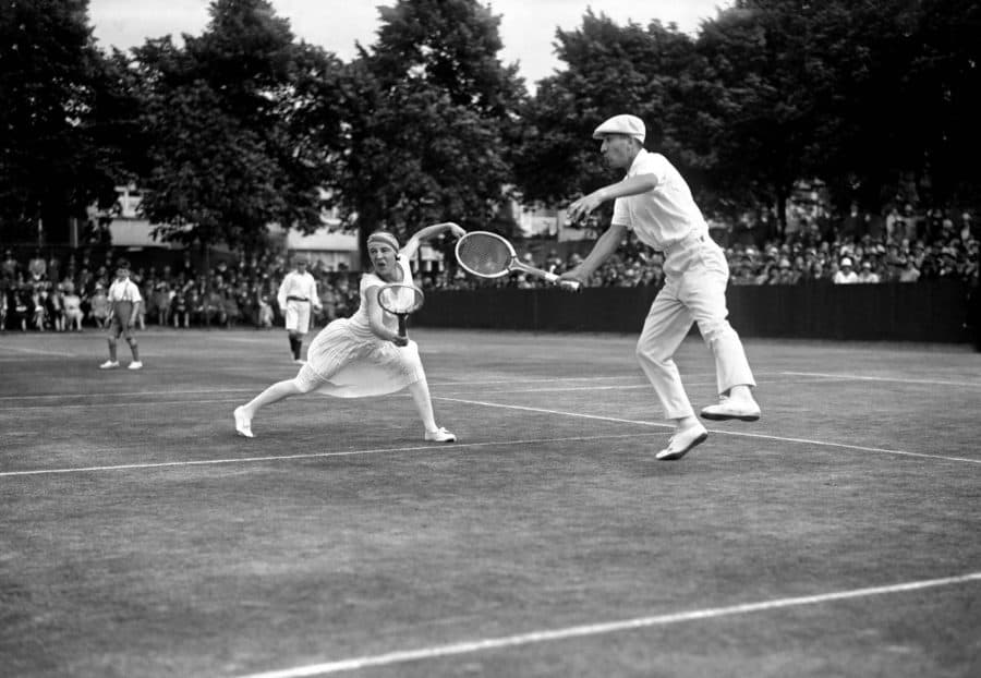 A polo shirt with trousers on the court